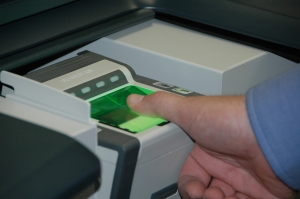 101012-N-7061S-018 SAN DIEGO (Oct. 12, 2010) A software engineer tests a digital fingerprint system after installation at the Fleet and Industrial Supply Center San Diego security office. Using digital fingerprints instead of traditional paper and ink increases the accuracy of fingerprinting and reduces overall timelines for processing personnel investigations. The machine is the first of its kind in the Naval Supply Systems Command Enterprise. (U.S. Navy photo by Aaron Schoenfeld/Released)